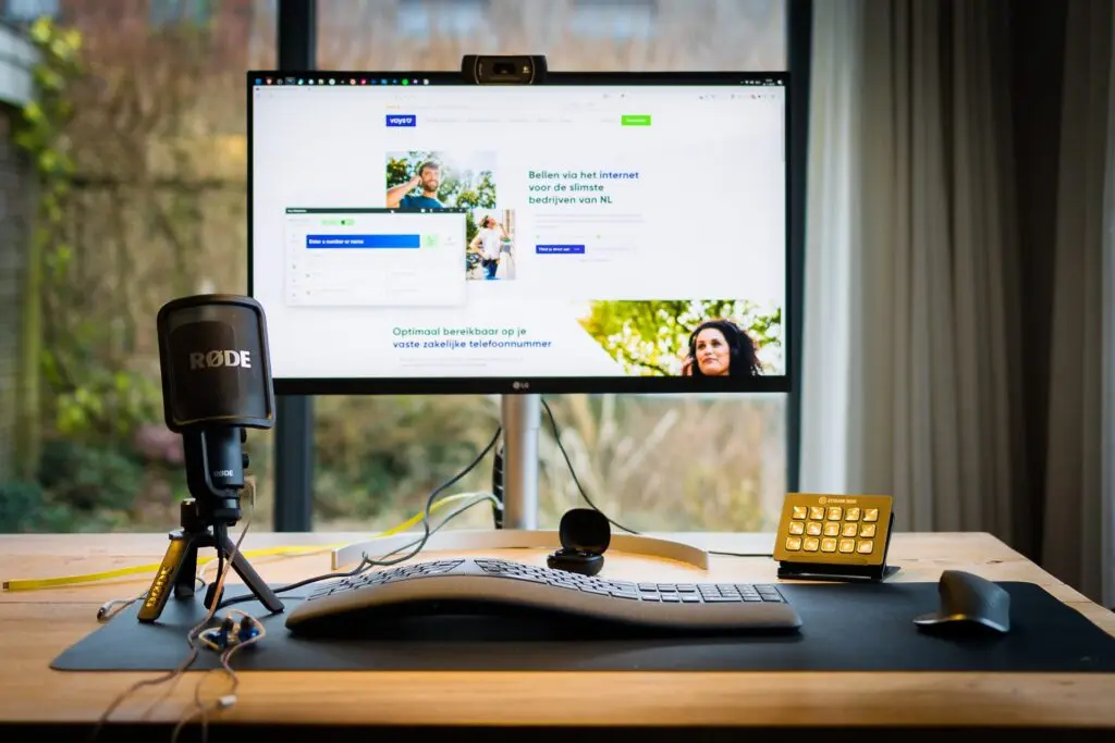 rode microphone setup at desk with pc screen