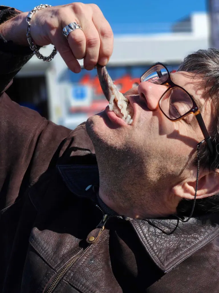 Colleague Alex, trying some local Herring on the trip in the Netherlands
