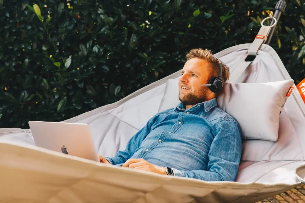 Relaxing in Hammock and using the Voys webphone on a laptop