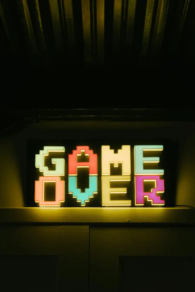 old 80s pixelated font saying Game Over