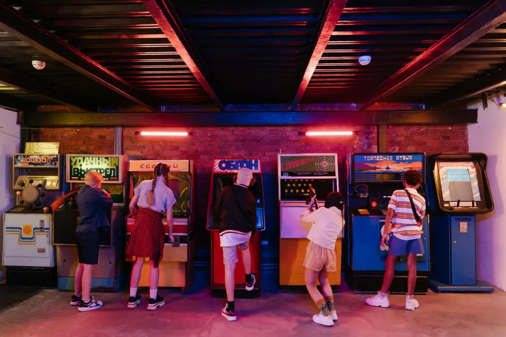 Kid in the 80s playing video games at the arcade