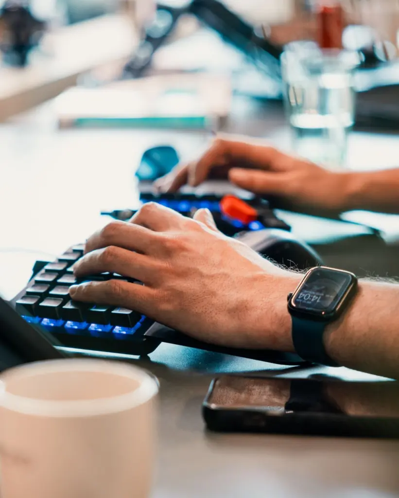 Voys colleague typing on a keyboard hands only